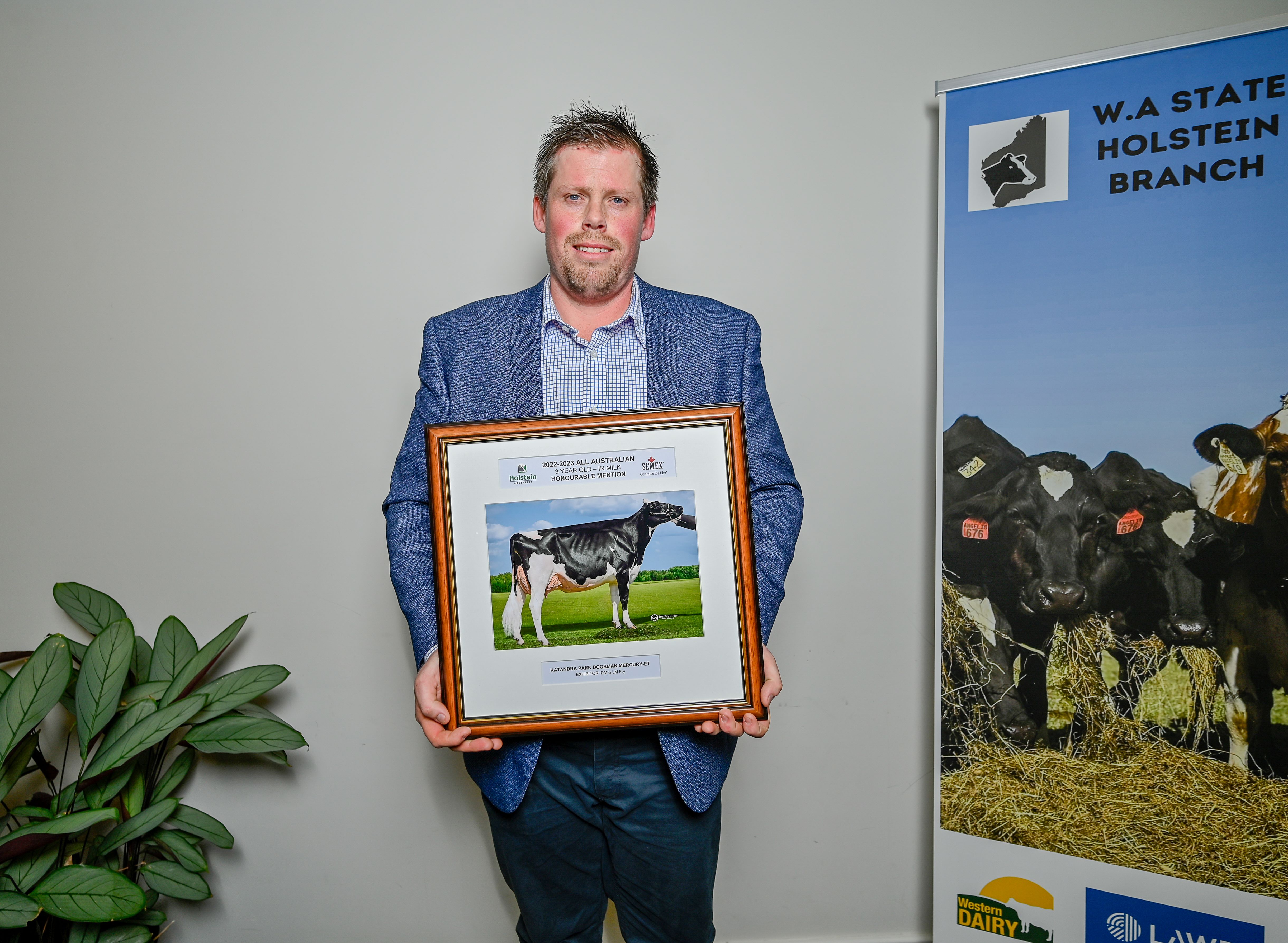 Lachlan Fry accepting an All Australian Award on behalf of Katandra Park Holsteins